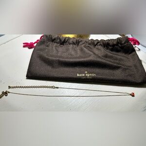 Kate Spade gold-tone necklace with pink stone charm